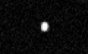 Obraz Quaoar wykonany przez nałożenie 16-tu ekspozycji z teleskopu Hubble'a, credits: NASA
