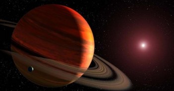 Egzoksiężyc krążący wokół gazowego giganta / Credits - NASA/ESA/G.Bacon (STScI)