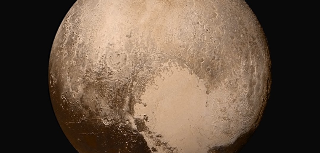 Pluton z 14 lipca 2015 roku, z odległości około 450 tysięcy km. Po środku Tombaugh Regio. / Credits - NASA / Johns Hopkins University Applied Physics Laboratory / Southwest Research Institute